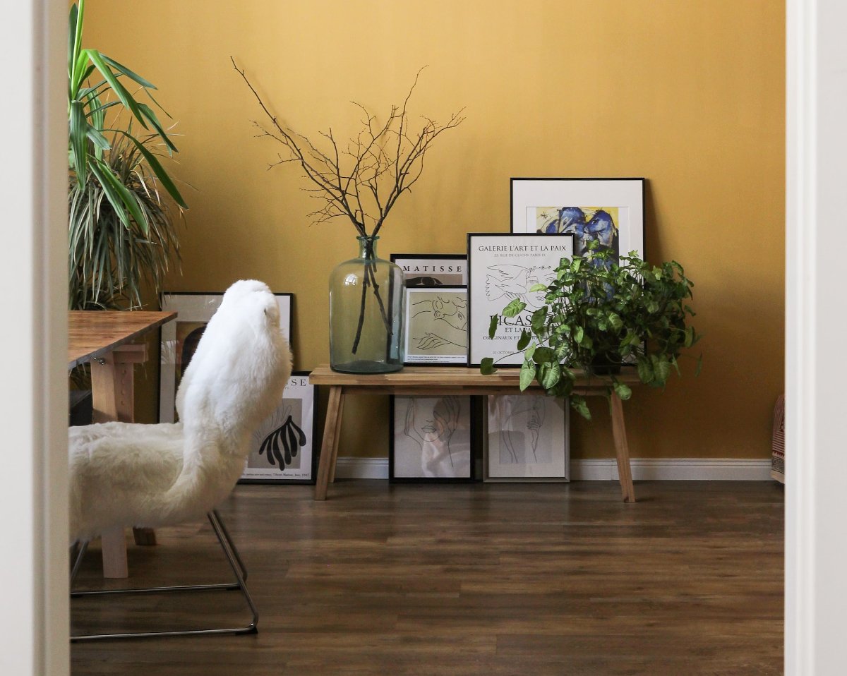 Study with hardwood floor and furry white chair