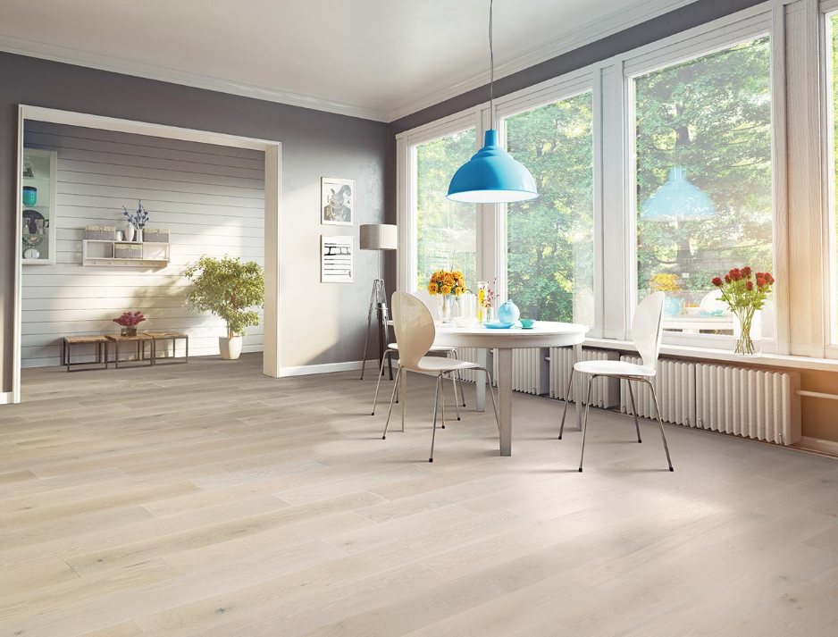 Modern living room with light hardwood flooring.